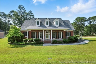 A beautifully updated brick home nestled on a peaceful corner on Kings Grant Golf and Country Club in North Carolina - for sale on GolfHomes.com, golf home, golf lot