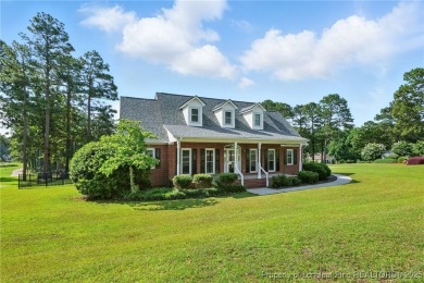 A beautifully updated brick home nestled on a peaceful corner on Kings Grant Golf and Country Club in North Carolina - for sale on GolfHomes.com, golf home, golf lot