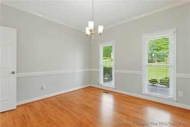 A beautifully updated brick home nestled on a peaceful corner on Kings Grant Golf and Country Club in North Carolina - for sale on GolfHomes.com, golf home, golf lot