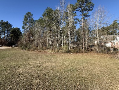 This beautiful partially wooded lot on Hole 14 of Shadow Ridge on Shadow Ridge Golf Club in Mississippi - for sale on GolfHomes.com, golf home, golf lot