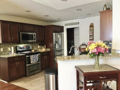 Nicely maintained concrete block home in the much sought after on Spanish Lakes I in Florida - for sale on GolfHomes.com, golf home, golf lot