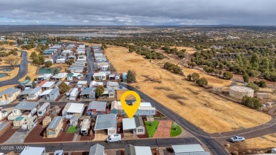 This well-kept park model boasts vaulted ceilings and natural on Juniper Ridge R.V. Golf Resort in Arizona - for sale on GolfHomes.com, golf home, golf lot