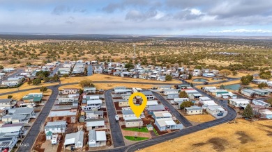 This well-kept park model boasts vaulted ceilings and natural on Juniper Ridge R.V. Golf Resort in Arizona - for sale on GolfHomes.com, golf home, golf lot