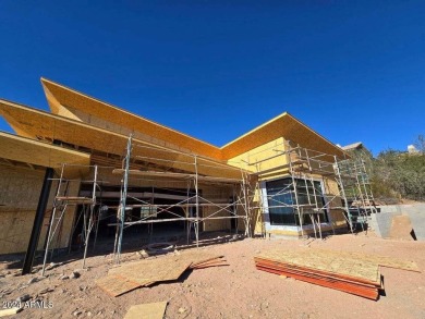 Contemporary new build designed for seamless indoor-outdoor on Eagle Mountain Golf Club in Arizona - for sale on GolfHomes.com, golf home, golf lot