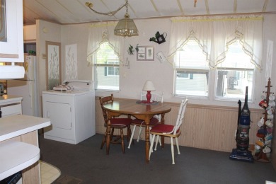 This 2 bedroom 1.5 bath Chariot Eagle Park Model with attached on Indian Mound Golf Club in New Hampshire - for sale on GolfHomes.com, golf home, golf lot