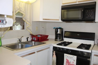 This 2 bedroom 1.5 bath Chariot Eagle Park Model with attached on Indian Mound Golf Club in New Hampshire - for sale on GolfHomes.com, golf home, golf lot