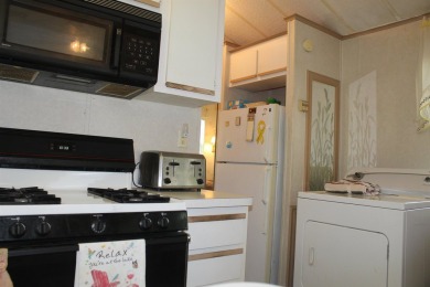 This 2 bedroom 1.5 bath Chariot Eagle Park Model with attached on Indian Mound Golf Club in New Hampshire - for sale on GolfHomes.com, golf home, golf lot