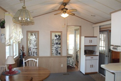 This 2 bedroom 1.5 bath Chariot Eagle Park Model with attached on Indian Mound Golf Club in New Hampshire - for sale on GolfHomes.com, golf home, golf lot