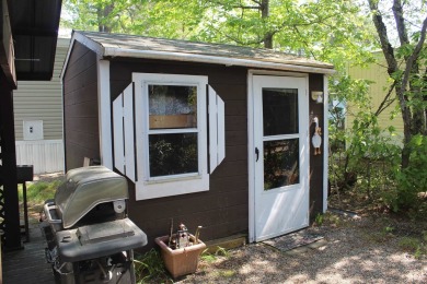 This 2 bedroom 1.5 bath Chariot Eagle Park Model with attached on Indian Mound Golf Club in New Hampshire - for sale on GolfHomes.com, golf home, golf lot