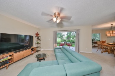 Discover serene and low-maintenance lakeside living in the heart on Clearwater Executive Golf Course in Florida - for sale on GolfHomes.com, golf home, golf lot