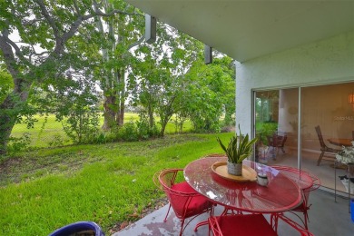 Discover serene and low-maintenance lakeside living in the heart on Clearwater Executive Golf Course in Florida - for sale on GolfHomes.com, golf home, golf lot