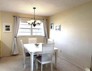 Meticulously Kept Two Bedroom / Two Bath Condo with Beautiful on The American Golf Club in Florida - for sale on GolfHomes.com, golf home, golf lot