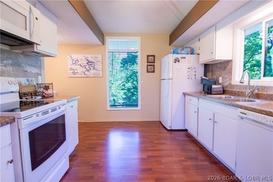 Welcome to your perfect retreat in the iconic Tan Tar A on The Oaks Golf Course in Missouri - for sale on GolfHomes.com, golf home, golf lot