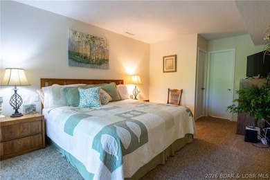 Welcome to your perfect retreat in the iconic Tan Tar A on The Oaks Golf Course in Missouri - for sale on GolfHomes.com, golf home, golf lot