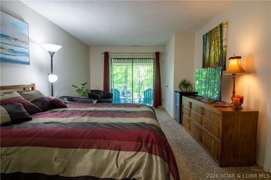 Welcome to your perfect retreat in the iconic Tan Tar A on The Oaks Golf Course in Missouri - for sale on GolfHomes.com, golf home, golf lot