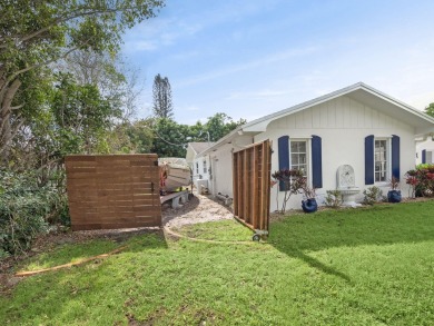 THIS SPACIOUS 4 BEDROOM/2 BATH HOME WITH A LARGE SCREENED IN on Tequesta Country Club in Florida - for sale on GolfHomes.com, golf home, golf lot