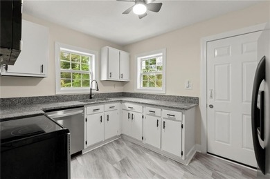 This charming, updated 2-bedroom, 1-bath home offers a rare on John A. White Golf Course in Georgia - for sale on GolfHomes.com, golf home, golf lot