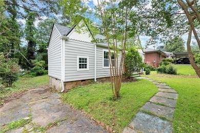 This charming, updated 2-bedroom, 1-bath home offers a rare on John A. White Golf Course in Georgia - for sale on GolfHomes.com, golf home, golf lot