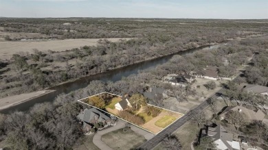 Welcome to your new riverfront home nestled in the prestigious on Pecan Plantation Country Club in Texas - for sale on GolfHomes.com, golf home, golf lot