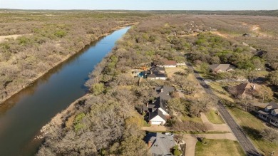Welcome to your new riverfront home nestled in the prestigious on Pecan Plantation Country Club in Texas - for sale on GolfHomes.com, golf home, golf lot