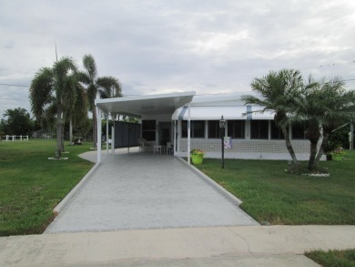HUGE CORNER LOT PROPERTY WITH A PRIVATE DOCK & WITH A BEAUTIFUL on Cypress Creek Country Club - Boynton Beach in Florida - for sale on GolfHomes.com, golf home, golf lot