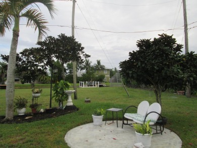 HUGE CORNER LOT PROPERTY WITH A PRIVATE DOCK & WITH A BEAUTIFUL on Cypress Creek Country Club - Boynton Beach in Florida - for sale on GolfHomes.com, golf home, golf lot