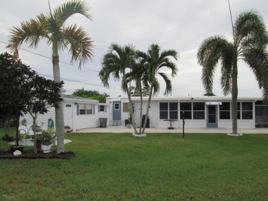 HUGE CORNER LOT PROPERTY WITH A PRIVATE DOCK & WITH A BEAUTIFUL on Cypress Creek Country Club - Boynton Beach in Florida - for sale on GolfHomes.com, golf home, golf lot