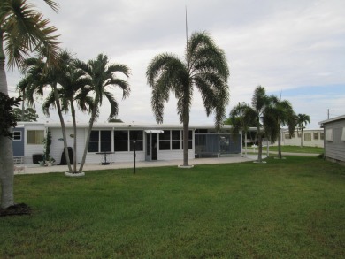 HUGE CORNER LOT PROPERTY WITH A PRIVATE DOCK & WITH A BEAUTIFUL on Cypress Creek Country Club - Boynton Beach in Florida - for sale on GolfHomes.com, golf home, golf lot