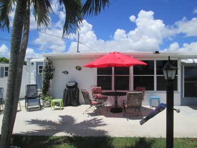 HUGE CORNER LOT PROPERTY WITH A PRIVATE DOCK & WITH A BEAUTIFUL on Cypress Creek Country Club - Boynton Beach in Florida - for sale on GolfHomes.com, golf home, golf lot