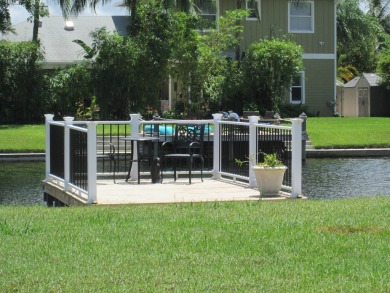 HUGE CORNER LOT PROPERTY WITH A PRIVATE DOCK & WITH A BEAUTIFUL on Cypress Creek Country Club - Boynton Beach in Florida - for sale on GolfHomes.com, golf home, golf lot