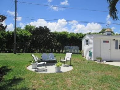 HUGE CORNER LOT PROPERTY WITH A PRIVATE DOCK & WITH A BEAUTIFUL on Cypress Creek Country Club - Boynton Beach in Florida - for sale on GolfHomes.com, golf home, golf lot