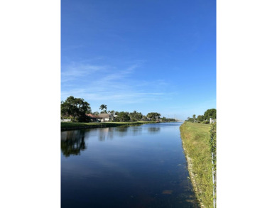HUGE CORNER LOT PROPERTY WITH A PRIVATE DOCK & WITH A BEAUTIFUL on Cypress Creek Country Club - Boynton Beach in Florida - for sale on GolfHomes.com, golf home, golf lot