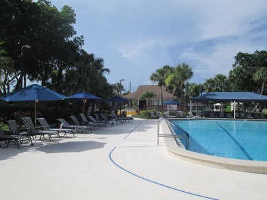 HUGE CORNER LOT PROPERTY WITH A PRIVATE DOCK & WITH A BEAUTIFUL on Cypress Creek Country Club - Boynton Beach in Florida - for sale on GolfHomes.com, golf home, golf lot