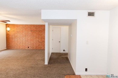 This well-maintained townhome boasts beautiful views of the golf on Chaparral Country Club in New Mexico - for sale on GolfHomes.com, golf home, golf lot