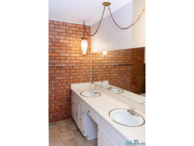 This well-maintained townhome boasts beautiful views of the golf on Chaparral Country Club in New Mexico - for sale on GolfHomes.com, golf home, golf lot