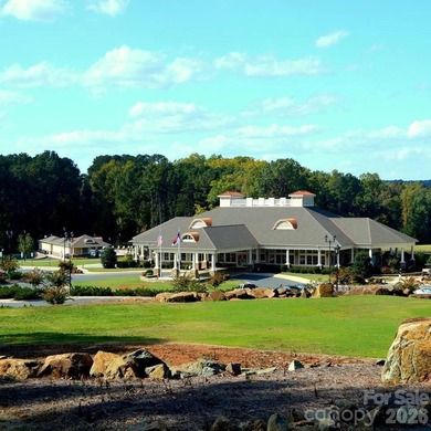 Discover the perfect canvas for luxury living on the 14th hole on The Tillery Tradition Country Club in North Carolina - for sale on GolfHomes.com, golf home, golf lot