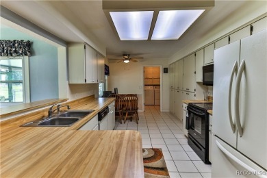 This 2-bedroom, 2-bathroom home features a 2-car garage on Brentwood Farms Golf Club in Florida - for sale on GolfHomes.com, golf home, golf lot