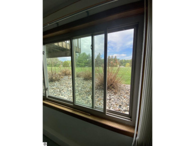 This is a great deal for a 4 bedroom, 3 bath condo just minutes on Crown Golf Course in Michigan - for sale on GolfHomes.com, golf home, golf lot