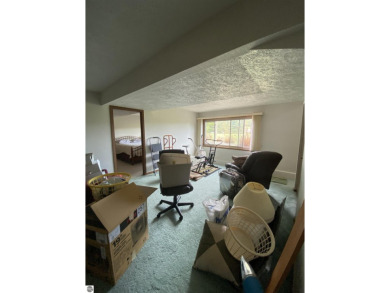 This is a great deal for a 4 bedroom, 3 bath condo just minutes on Crown Golf Course in Michigan - for sale on GolfHomes.com, golf home, golf lot
