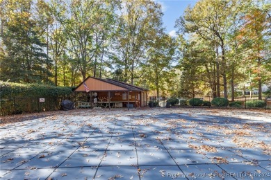 Located in a 24-hour guarded/gated community, this meticulously on Carolina Trace Country Club in North Carolina - for sale on GolfHomes.com, golf home, golf lot