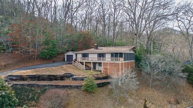 Tucked inside Mill Creek, this inviting mountain retreat is all on Mill Creek Country Club in North Carolina - for sale on GolfHomes.com, golf home, golf lot