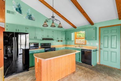 Tucked inside Mill Creek, this inviting mountain retreat is all on Mill Creek Country Club in North Carolina - for sale on GolfHomes.com, golf home, golf lot