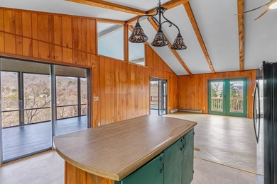 Tucked inside Mill Creek, this inviting mountain retreat is all on Mill Creek Country Club in North Carolina - for sale on GolfHomes.com, golf home, golf lot