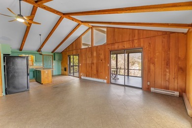 Tucked inside Mill Creek, this inviting mountain retreat is all on Mill Creek Country Club in North Carolina - for sale on GolfHomes.com, golf home, golf lot