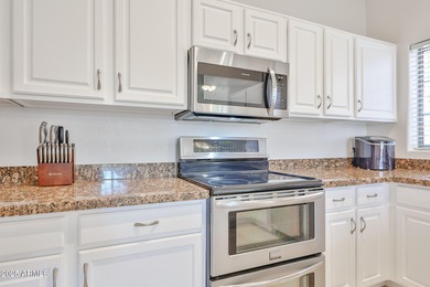 This lovely 2 bedroom, 2 bath townhome with an open layout & on Palm Valley Golf Club  in Arizona - for sale on GolfHomes.com, golf home, golf lot