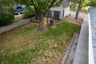 This stunning 4-bed, 3-bath ranch is perched directly across on Ellis Country Club in Kansas - for sale on GolfHomes.com, golf home, golf lot