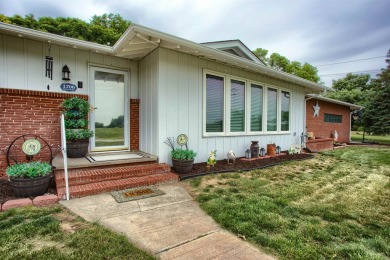 This stunning 4-bed, 3-bath ranch is perched directly across on Ellis Country Club in Kansas - for sale on GolfHomes.com, golf home, golf lot
