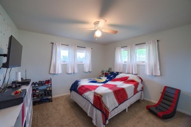 This stunning 4-bed, 3-bath ranch is perched directly across on Ellis Country Club in Kansas - for sale on GolfHomes.com, golf home, golf lot