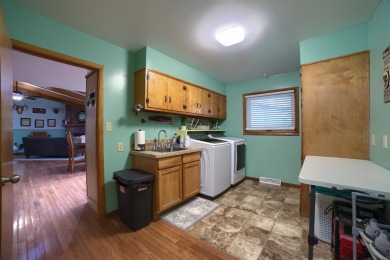 This stunning 4-bed, 3-bath ranch is perched directly across on Ellis Country Club in Kansas - for sale on GolfHomes.com, golf home, golf lot