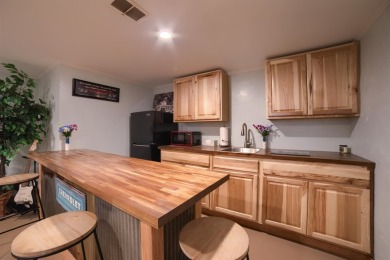 This stunning 4-bed, 3-bath ranch is perched directly across on Ellis Country Club in Kansas - for sale on GolfHomes.com, golf home, golf lot